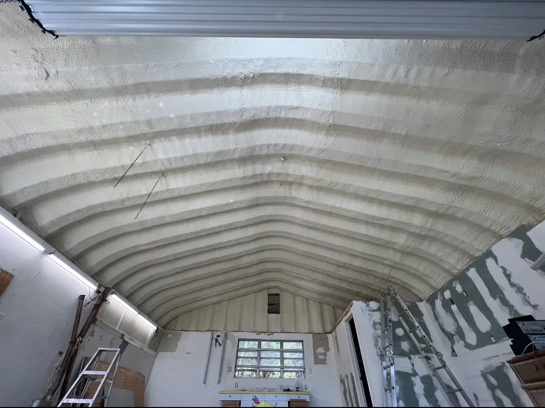 Spray polyurethane foam applied to the underside of a metal roof deck in Altamont